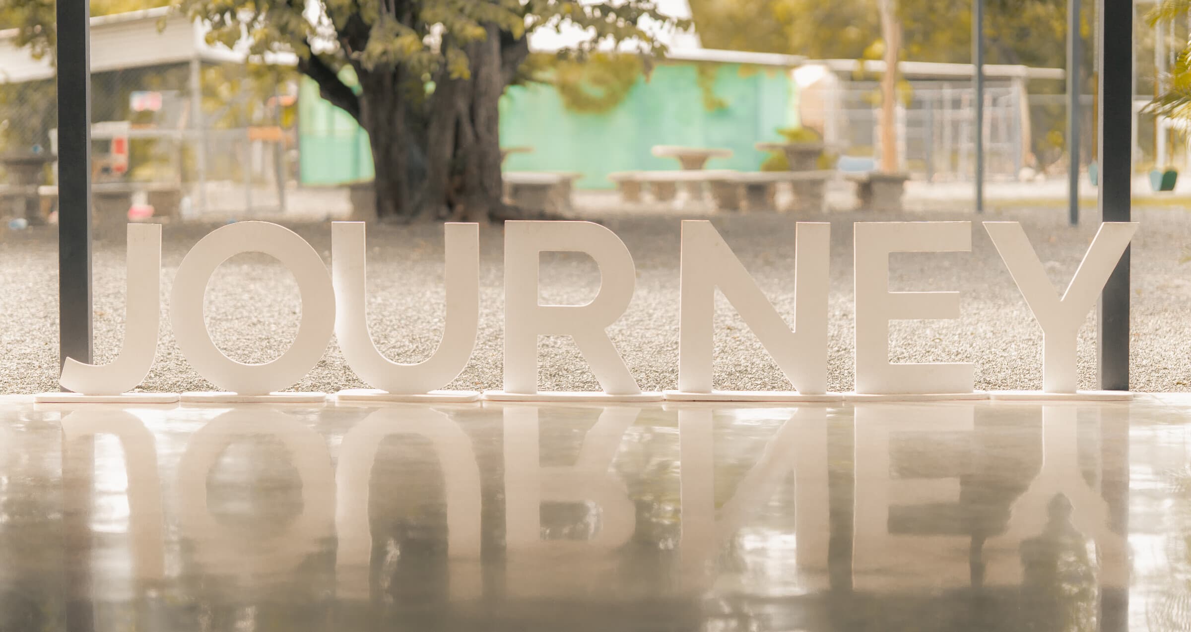 The big white JOURNEY letters at the campus entrance